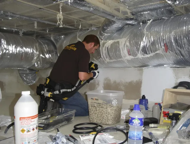 North Smithfield Air Duct Cleaning specialist performing professional mold removal from air ducts in North Smithfield