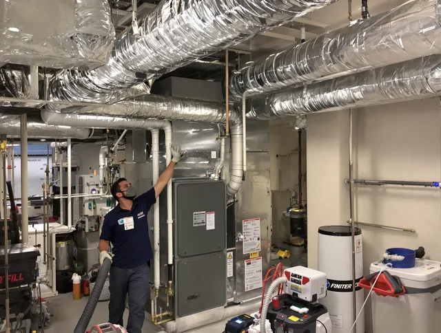 North Smithfield Air Duct Cleaning specialist performing thorough furnace duct cleaning in a North Smithfield residence