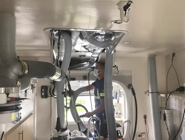North Smithfield Air Duct Cleaning specialist performing precise mobile home duct cleaning in North Smithfield
