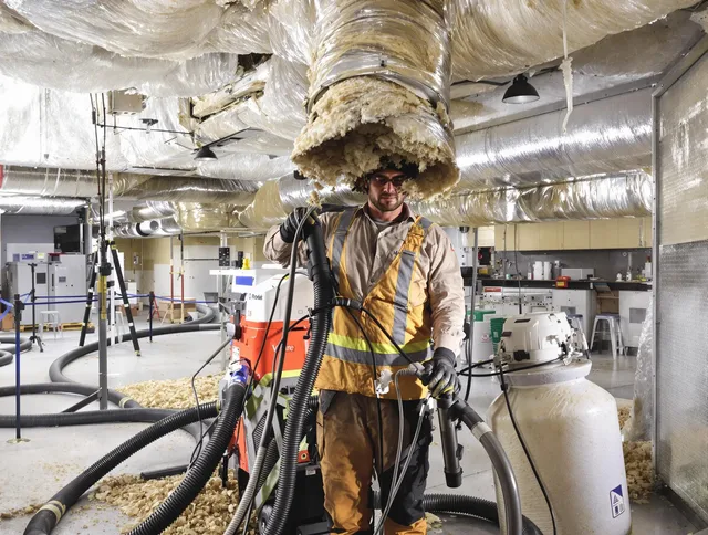Professional vacuum insulation removal by North Smithfield Air Duct Cleaning expert in North Smithfield